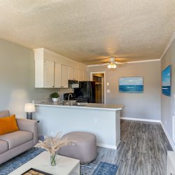 living room and kitchen view at Ashley Oaks Apartments located in Perry, GA